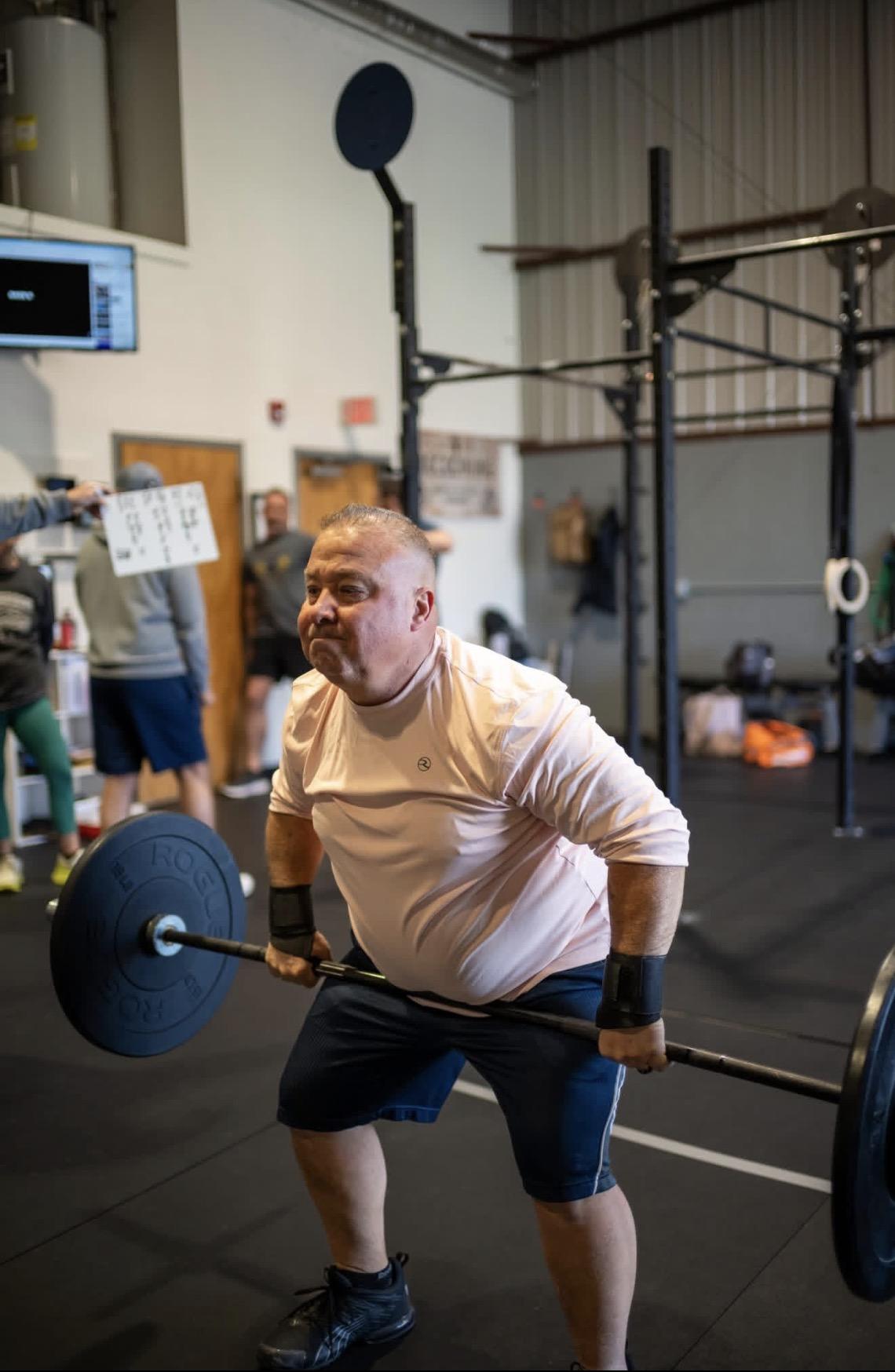 Member overhead press at CrossFit Reckoning